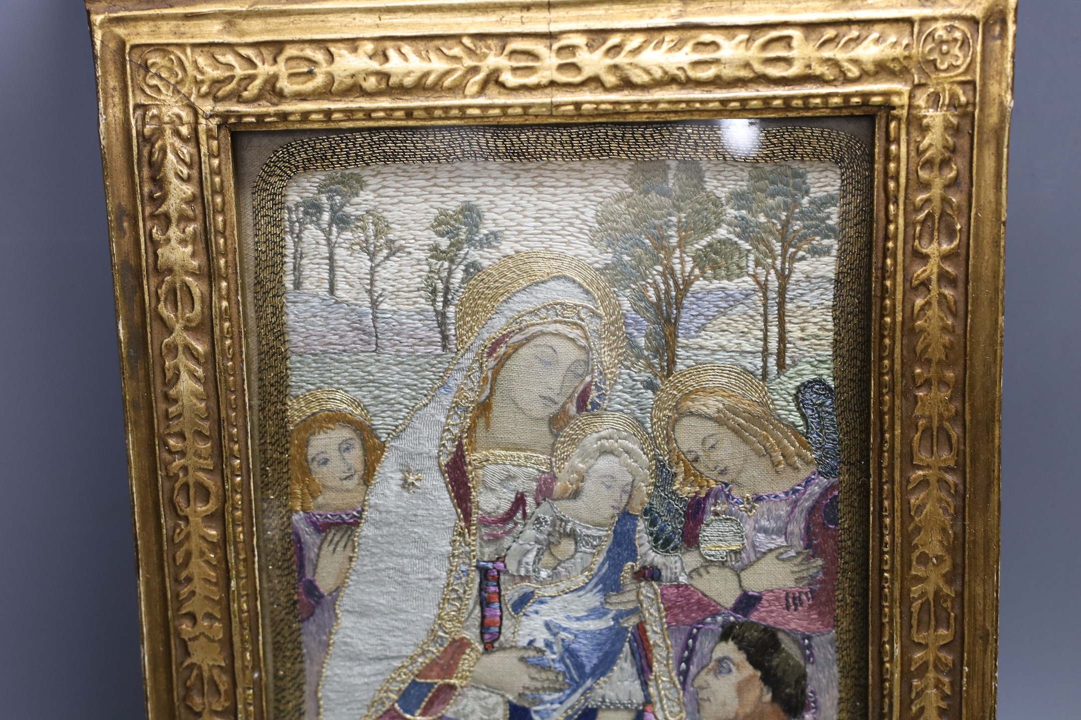 A silk thread embroidery of the 'Madonna of Peace', 36x24cm including gilt frame